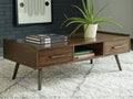 Signature design by Ashley Calmoni Coffee Table in Brown